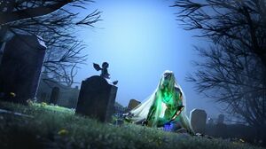 Ilona kneels at her son's grave.